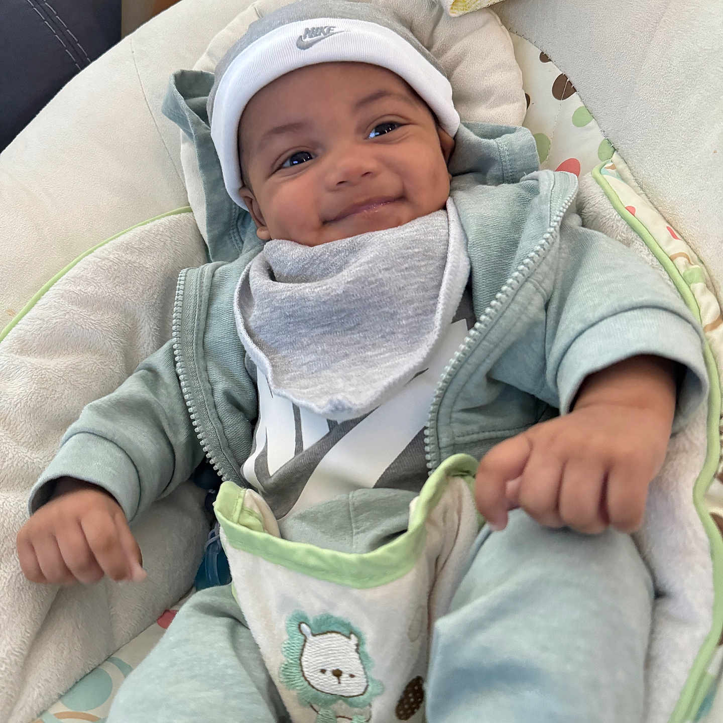 Legend joined the competition — help win amazing prizes! baby, babylaughing, blanket, bonnet, cap, clothing, coat, face, happy, hat, head, hood, jacket, knitwear, newborn, pants, person, photography, portrait, smile