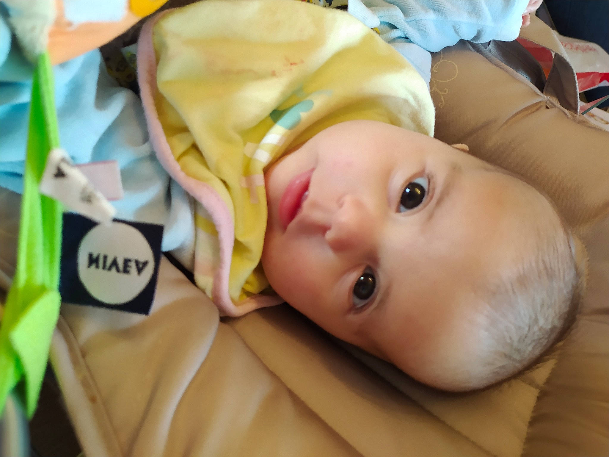 Maëlyne participe au concours pour gagner de l'argent avec cette photo : baby, baby_products, baby_toddler_clothing, cheek, child, chin, lip, nose, person, skin, toddler, yellow