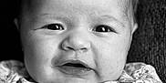 Autumn is registered to the contest to win money with this photo: baby, infant, face, portrait, black_and_white, expression, clothing, floral_pattern, closeup, skin, hair, eyes, mouth, newborn, cute, person, child, texture, soft_lighting, background