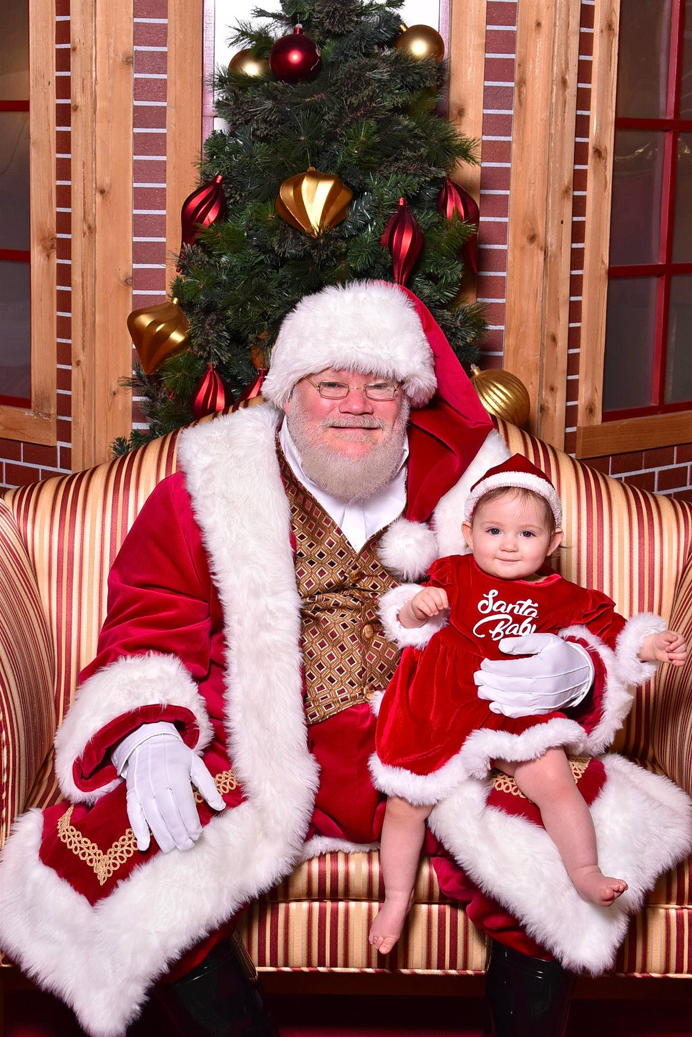 Amilla is registered to the contest to win money with this photo: christmas, christmas_decoration, christmas_eve, christmas_ornament, christmas_tree, event, fun, fur, happy, hat, headwear, holiday, holiday_ornament, joy, lap, person, red, santa_claus, smile, toddler