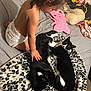 Pickles And Sofia joined the competition — help win amazing prizes! toddler, diaper, child, black_and_white_cat, cat, petting, blanket, leopard_print, bed, toy, pillow, indoor, curled_up, feline, sleeping_cat, child_playing, animal, cozy, home, cuddle