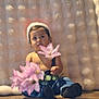 Karim Gomez joined the competition — help win amazing prizes! toddler, child, flower, pink_flower, hat, suspenders, jeans, black_socks, wooden_floor, cozy_background, curious_expression, indoors, portrait, cute, baby, sitting, soft_texture, innocent, person, casual_clothing