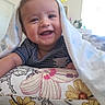 Christopher joined the competition — help win amazing prizes! baby, blanket, child, cozy, cushion, daylight, eyes, face, floral, furniture, happy, home, indoor, infant, portrait, seated, short_hair, smiling, striped_shirt, teeth