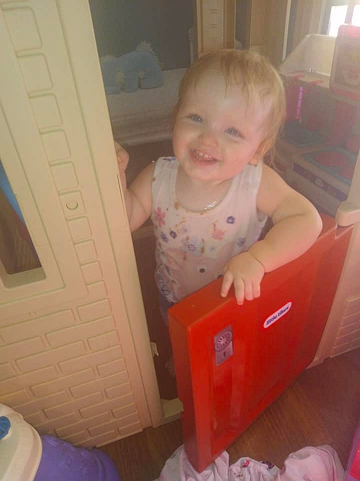 Aurelia is registered to the contest to win money with this photo: baby, baby_laughing, baby_products, baby_toddler_clothing, carmine, cheek, child, comfort, finger, flooring, fun, joy, mouth, person, pink, product, room, sitting, smile, standing