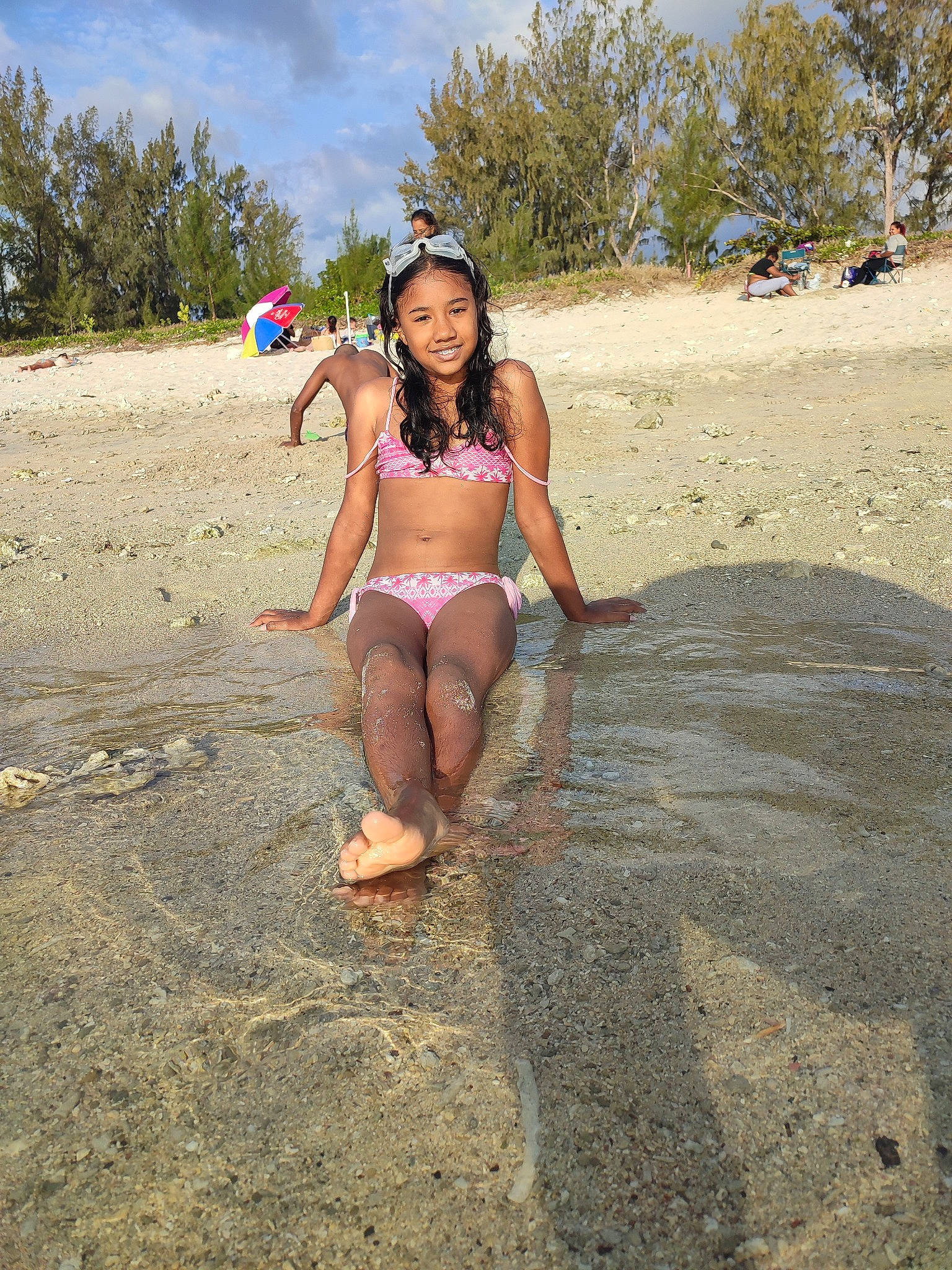 Célia participe au concours pour gagner de l'argent avec cette photo : barefoot, beach, body_of_water, brassiere, happy, joy, landscape, leg, leisure, people_in_nature, people_on_beach, person, sand, sky, smile, swimsuit_top, swimwear, thigh, travel, tree