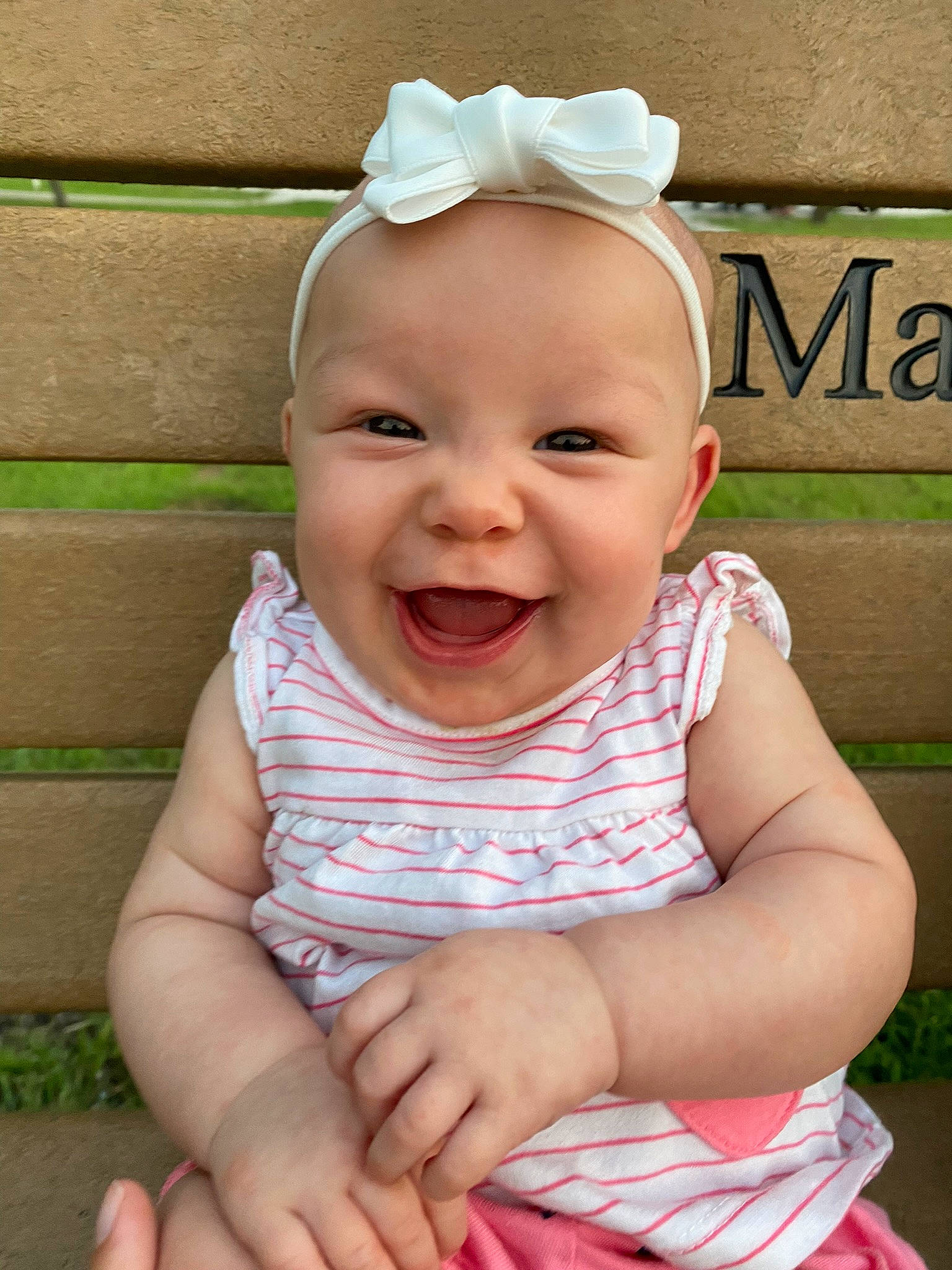 Arilynn is registered to the contest to win money with this photo: baby, baby_toddler_clothing, cheek, chin, eye, face, facial_expression, finger, fun, happy, head, iris, lip, person, pink, skin, sleeve, smile, standing, toddler