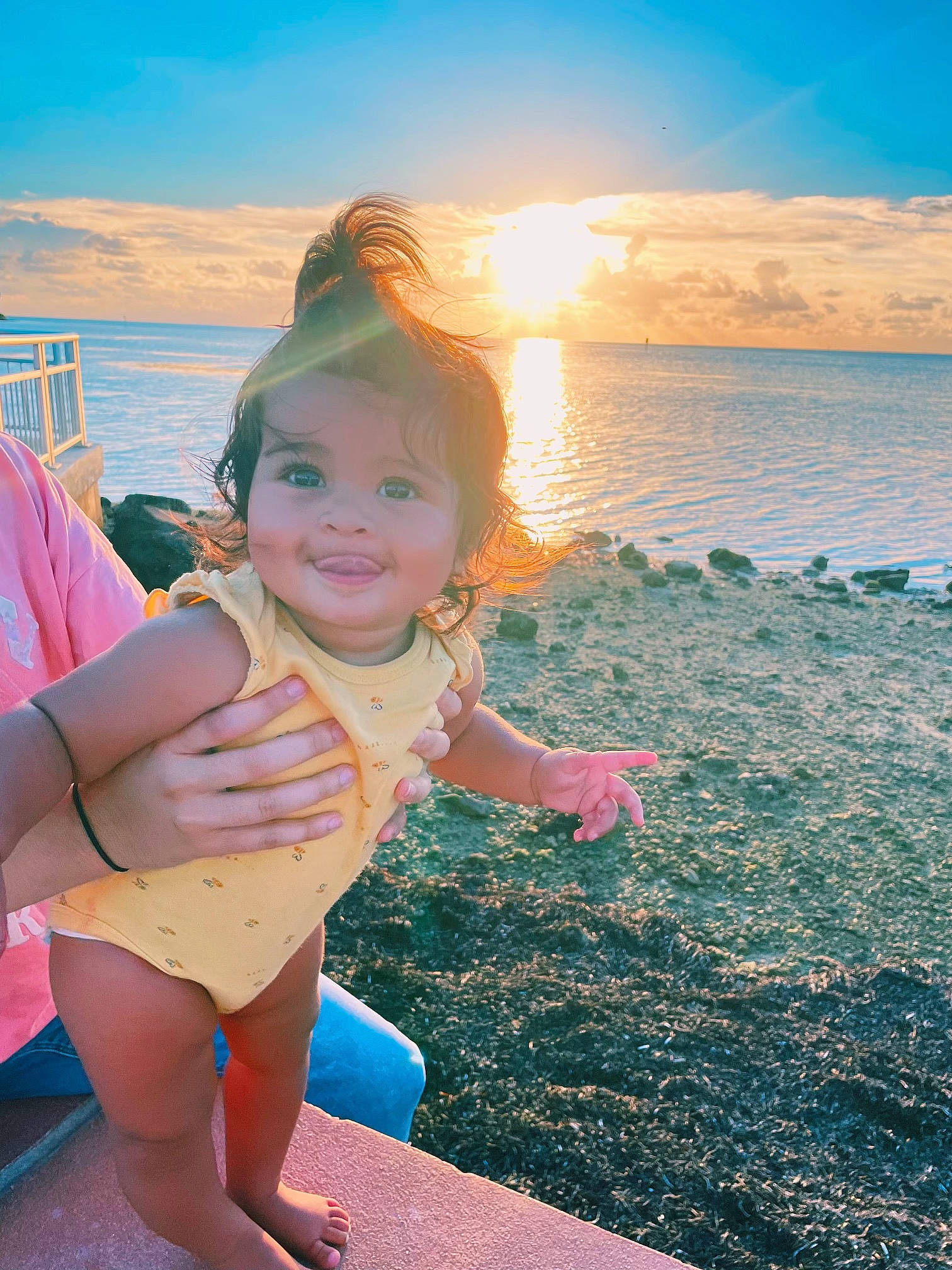 Tegan is registered to the contest to win money with this photo: beach, beauty, face, fun, happy, horizon, joy, lake, leisure, light, morning, people_in_nature, people_on_beach, person, sand, sky, smile, summer, sunlight, toddler