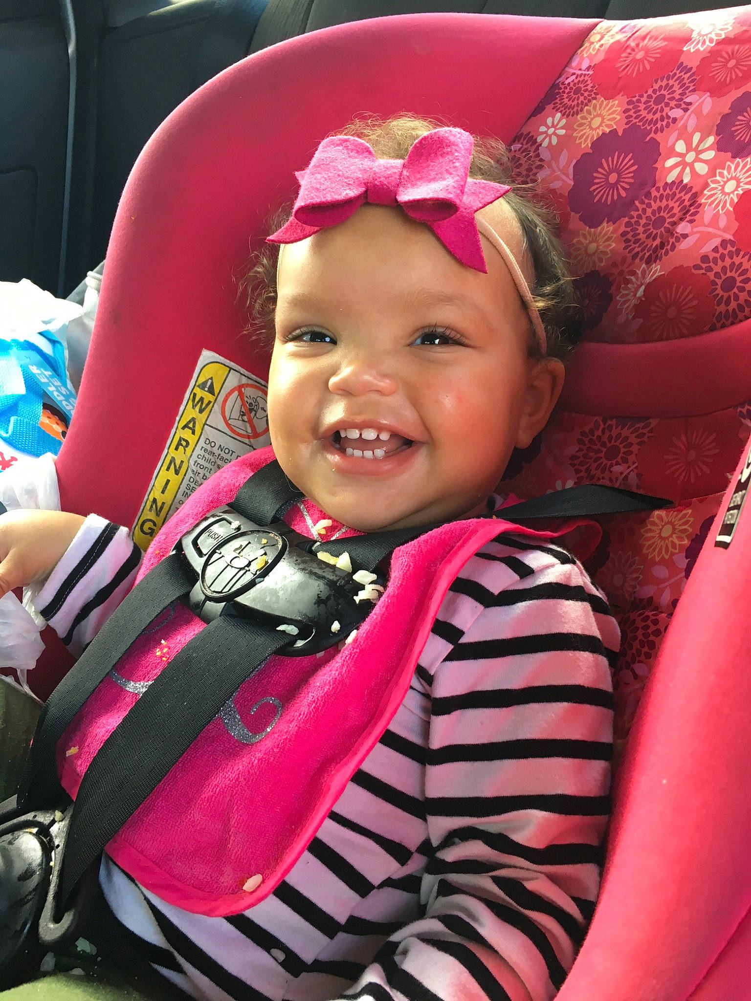 Marissa joined the competition — help win amazing prizes! car_seat, child, hair_accessory, headwear, magenta, person, pink, skin, smile, toddler