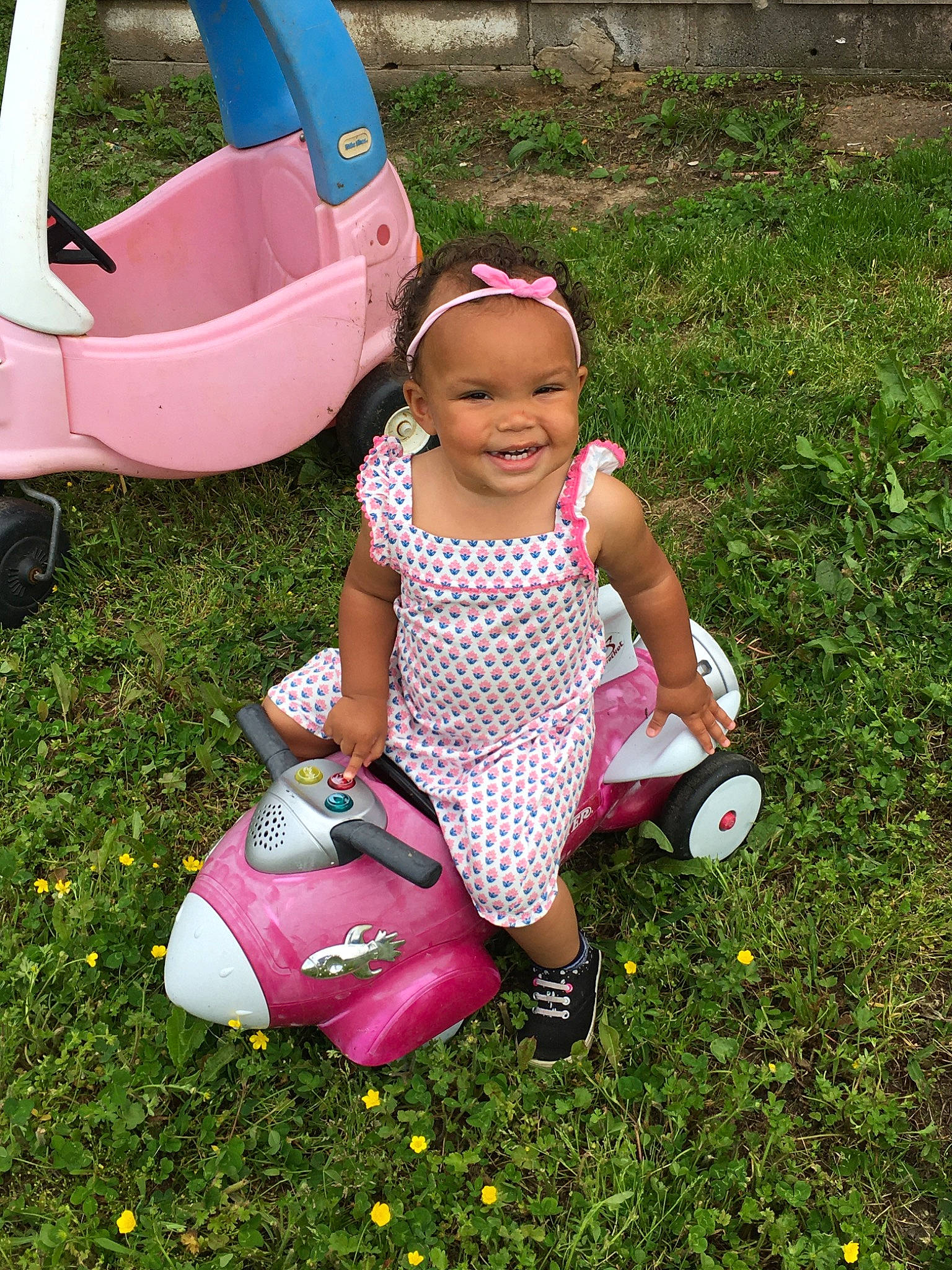 Marissa is registered to the contest to win money with this photo: child, fun, grass, happy, joy, leisure, person, pink, plant, play, product, sitting, smile, summer, toddler, vacation