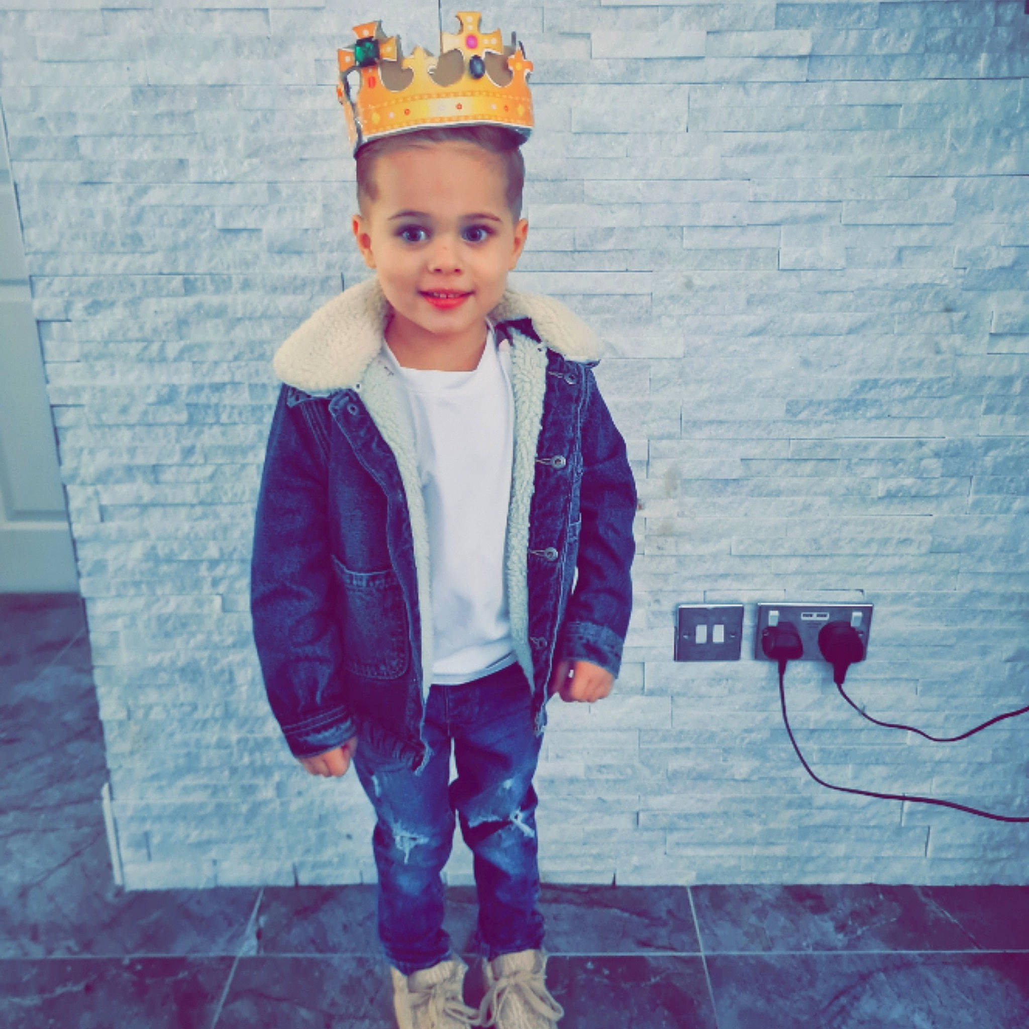 Angelo is registered to the contest to win money with this photo: baby_toddler_clothing, child, clothing, cool, costume_hat, denim, electric_blue, fashion_accessory, flooring, fun, happy, jacket, joy, magenta, outerwear, pattern, person, purple, sleeve, smile