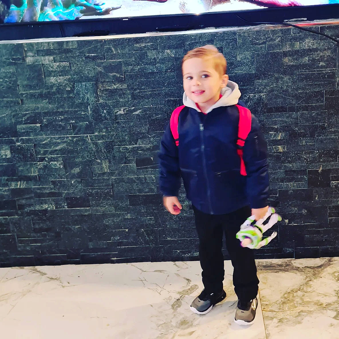 Angelo joined the competition — help win amazing prizes! asphalt, child, cool, denim, electric_blue, flooring, footwear, formal_wear, fun, happy, joy, leisure, person, road_surface, sitting, smile, sneakers, t_shirt, tints_and_shades, toddler