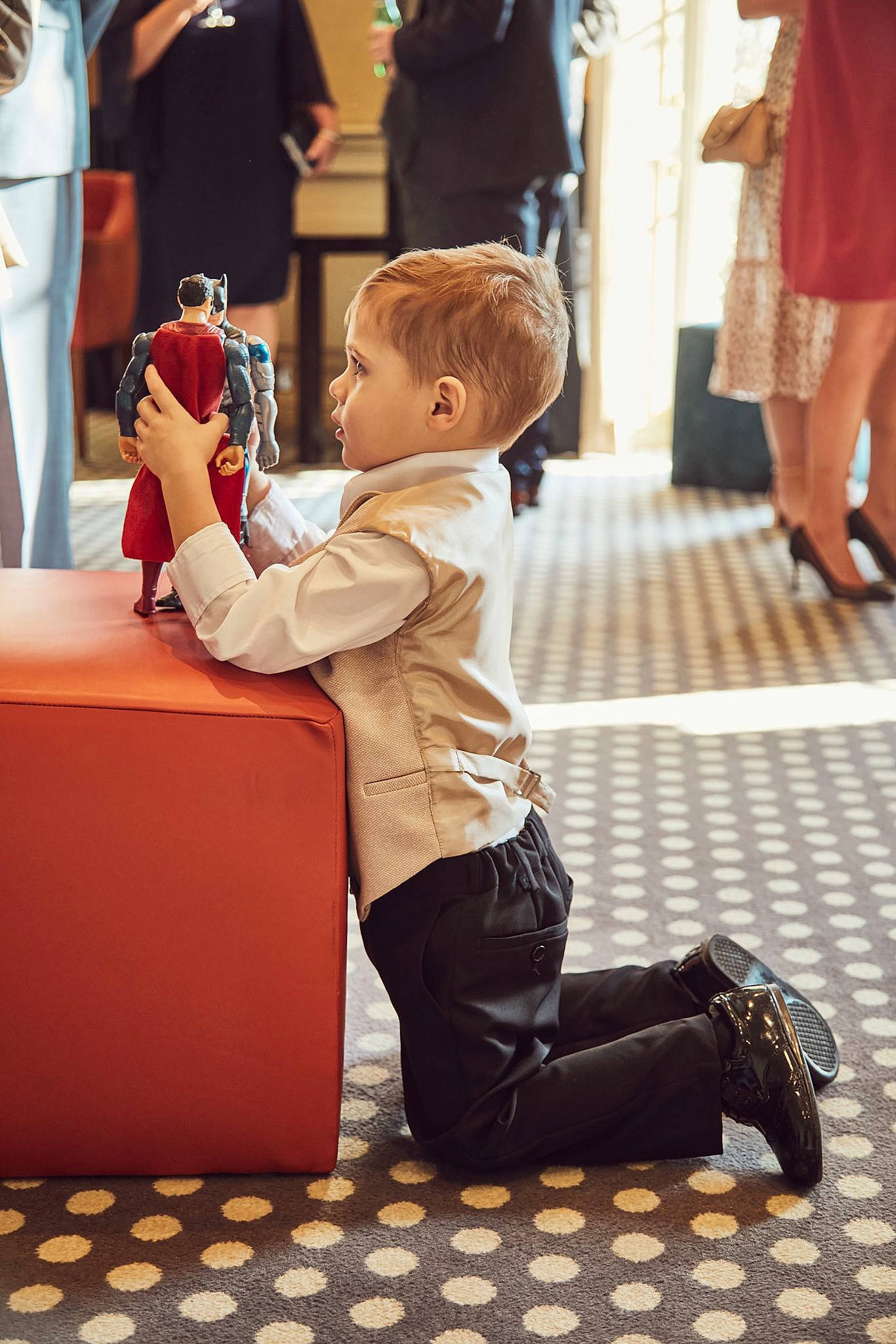 Angelo is registered to the contest to win money with this photo: baby, bag, child, event, flooring, fun, happy, hardwood, human_leg, joint, leg, leisure, luggage_and_bags, person, recreation, shoe, shorts, sitting, sneakers, toddler