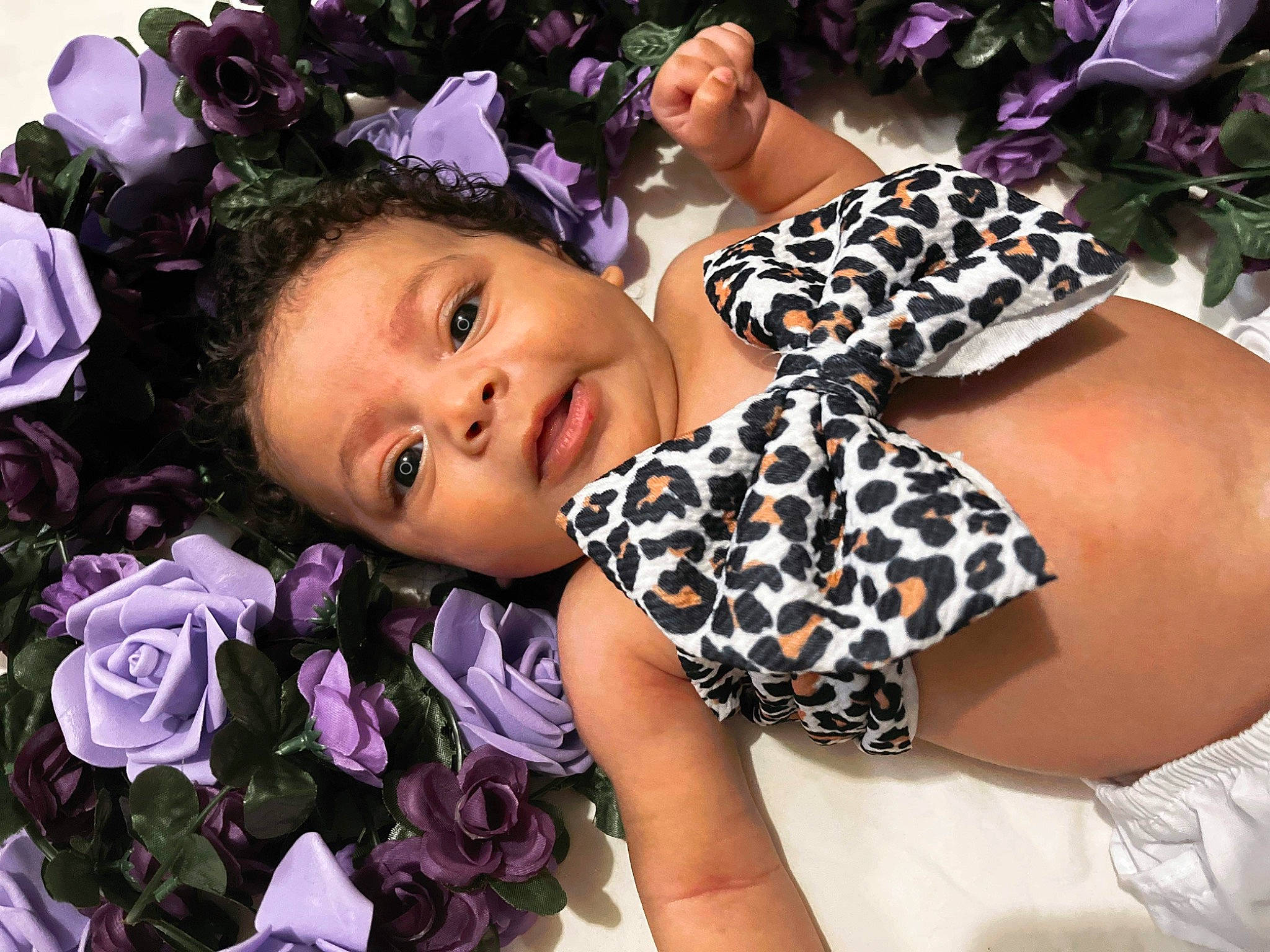 Islyn is registered to the contest to win money with this photo: child, event, eyewear, fashion_accessory, floral_design, flower, fun, hair_accessory, happy, headpiece, jewellery, nail, pattern, person, petal, pink, plant, purple, rose_family, toddler