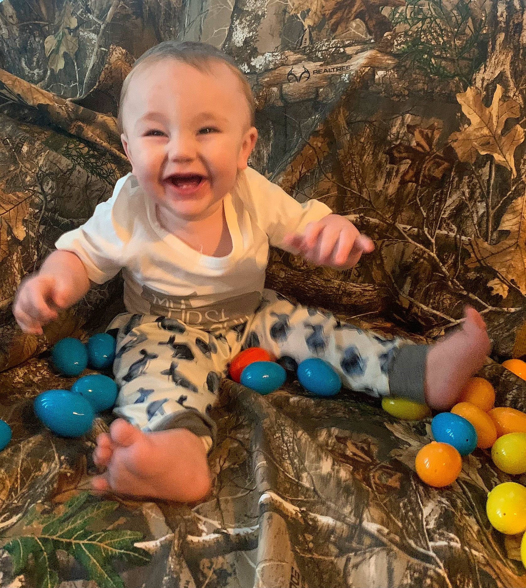 Huxley joined the competition — help win amazing prizes! baby, baby_toddler_clothing, beauty, child, face, fun, grass, happy, head, human_body, joy, leisure, nature, people_in_nature, person, photograph, play, sitting, smile, t_shirt