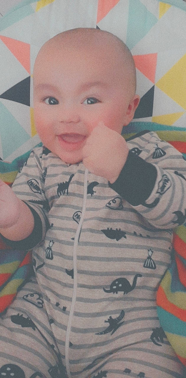 Patrick is registered to the contest to win money with this photo: arm, baby, baby_toddler_clothing, cheek, child, chin, cool, design, eye, eyebrow, face, forehead, head, lip, nose, pattern, person, skin, sleeve, smile