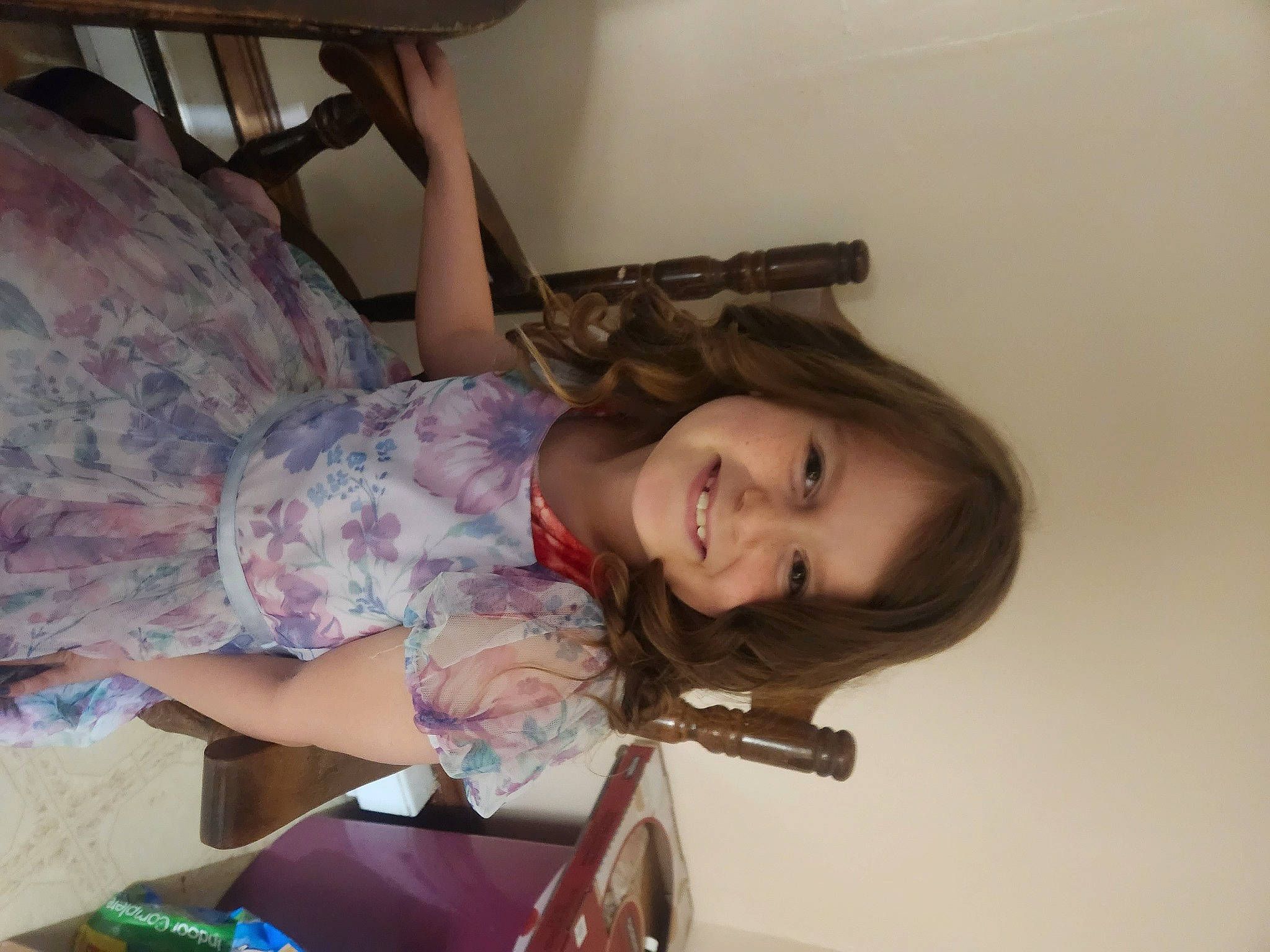 Emilee joined the competition — help win amazing prizes! brown_hair, child, comfort, eyelash, fun, hairstyle, happy, human_leg, joy, linens, long_hair, pattern, person, room, sitting, smile, thigh, toddler, wood