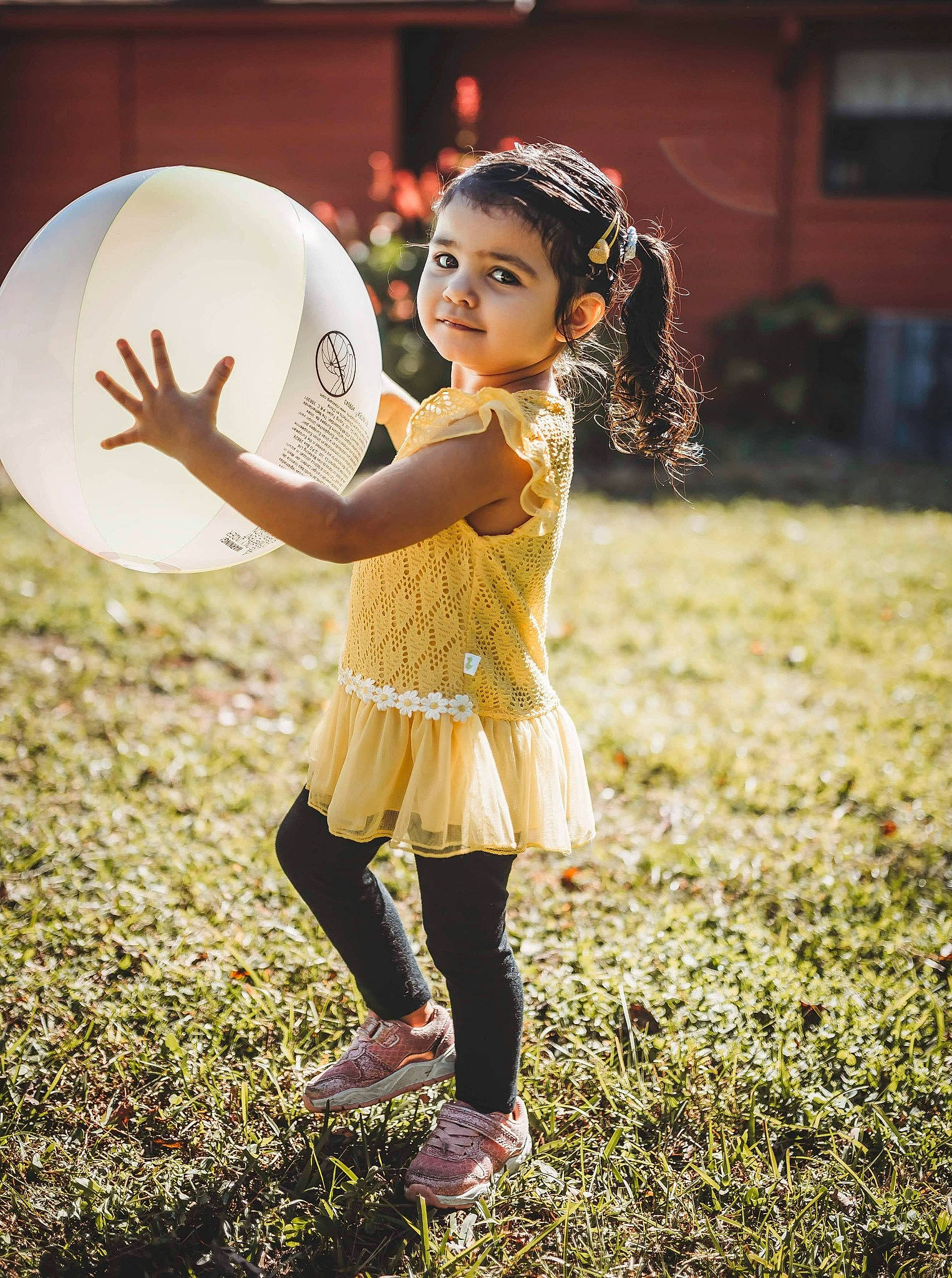 Isabel joined the competition — help win amazing prizes! astronomical_object, balloon, child, flash_photography, fun, gesture, grass, grassland, happy, headpiece, human_leg, leisure, membranophone, party_supply, people_in_nature, person, recreation, sandal, shoe, toddler