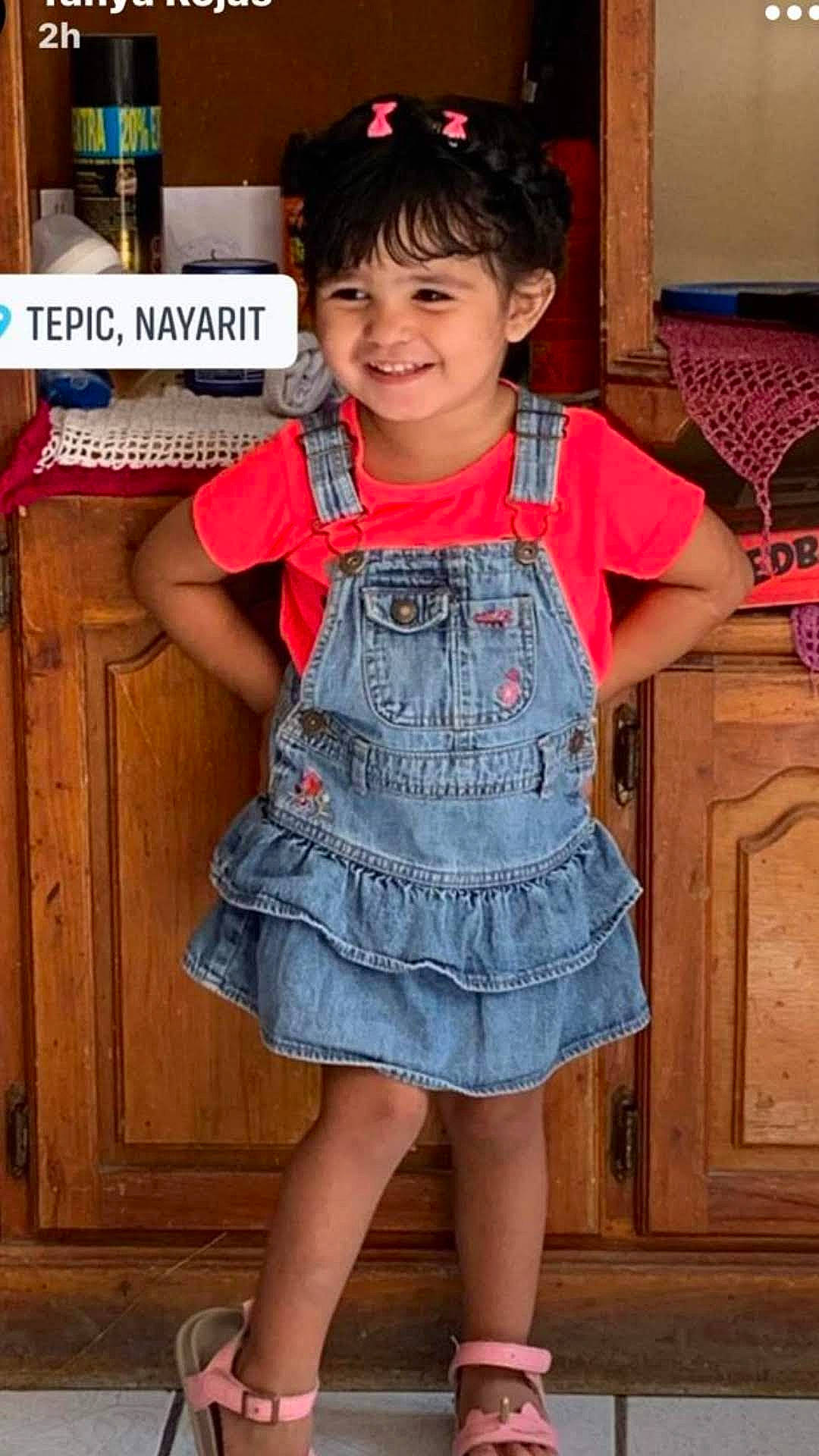 Isabel is registered to the contest to win money with this photo: baby_toddler_clothing, chin, clothing, cool, door, dress, eye, face, happy, joy, neck, one_piece_garment, organ, person, pink, shoulder, skin, sleeve, smile, standing