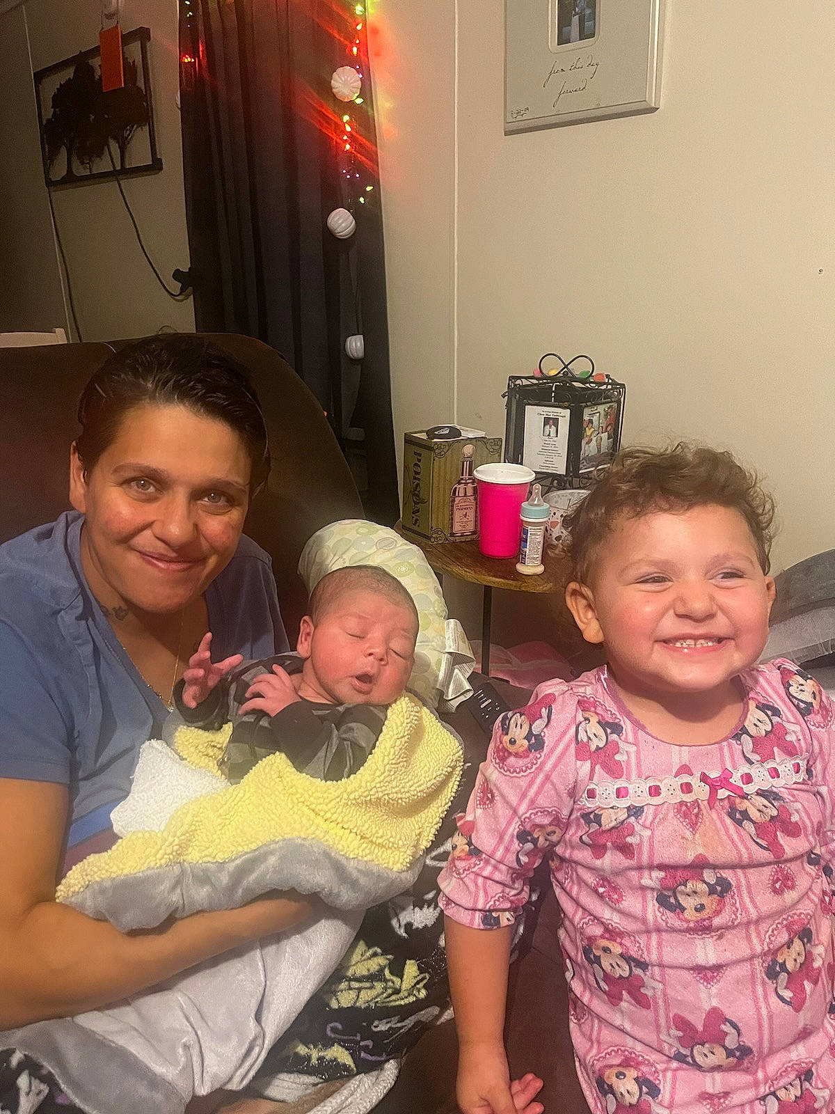 Anniemae is registered to the contest to win money with this photo: baby, baby_toddler_clothing, baseball_cap, child, event, eye, face, facial_expression, fun, happy, hat, head, joy, lap, person, picture_frame, room, sharing, skin, smile