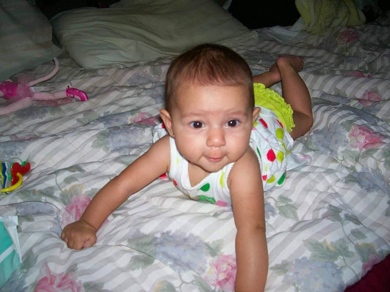 Macy joined the competition — help win amazing prizes! baby, baby_toddler_clothing, cheek, child, comfort, dress, finger, flash_photography, flooring, fun, grass, happy, iris, linens, mouth, nose, person, room, sitting, skin