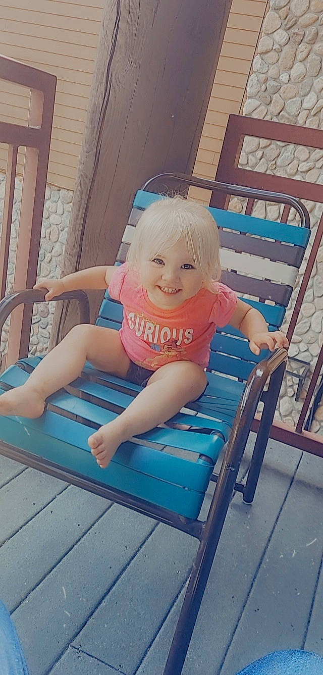 Aryanna joined the competition — help win amazing prizes! barefoot, blurred, chair, child, comfort, electric_blue, foot, fun, happy, human_leg, joint, joy, knee, leisure, magenta, outdoor_furniture, person, sitting, smile, sunlounger