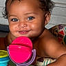 baby, child, smile, blue_eyes, curly_hair, toy, colorful, indoor, playtime, diaper, cute, portrait, happy, infant, face, skin, arm, sitting, closeup, play