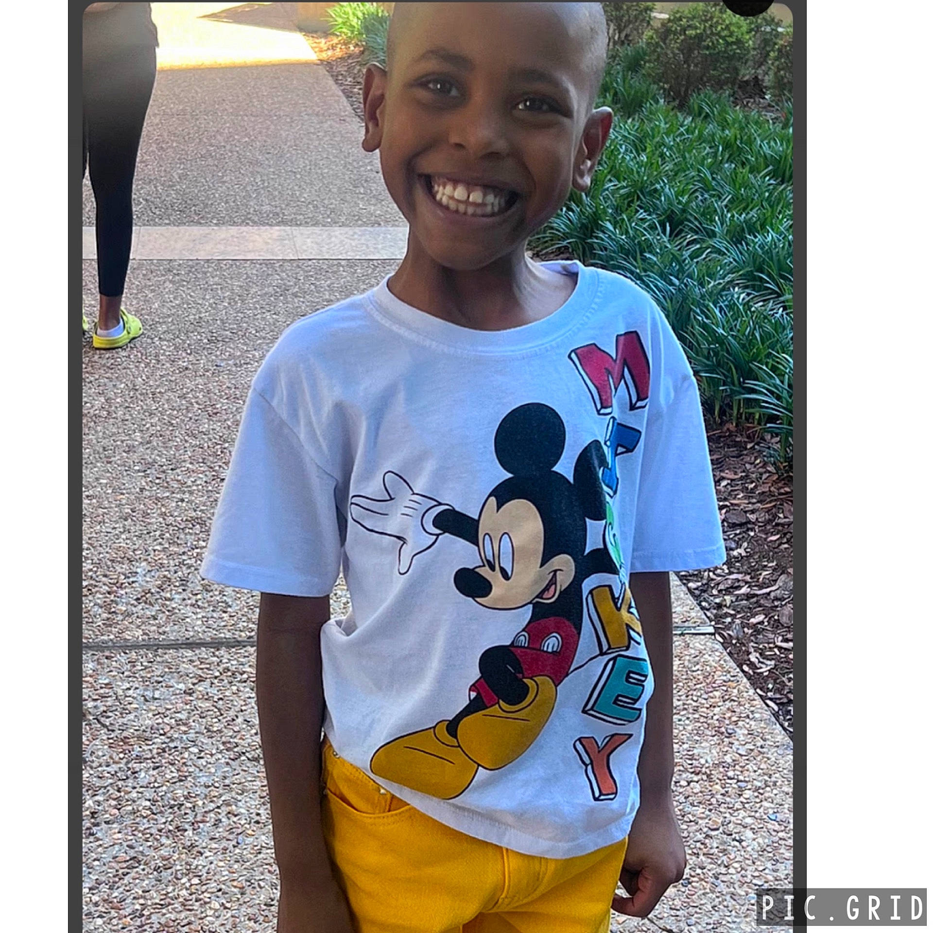 Joziah is registered to the contest to win money with this photo: boy, child, city, clothing, face, footwear, happy, head, male, path, person, photography, portrait, road, shirt, shoe, shorts, sleeve, smile, t_shirt