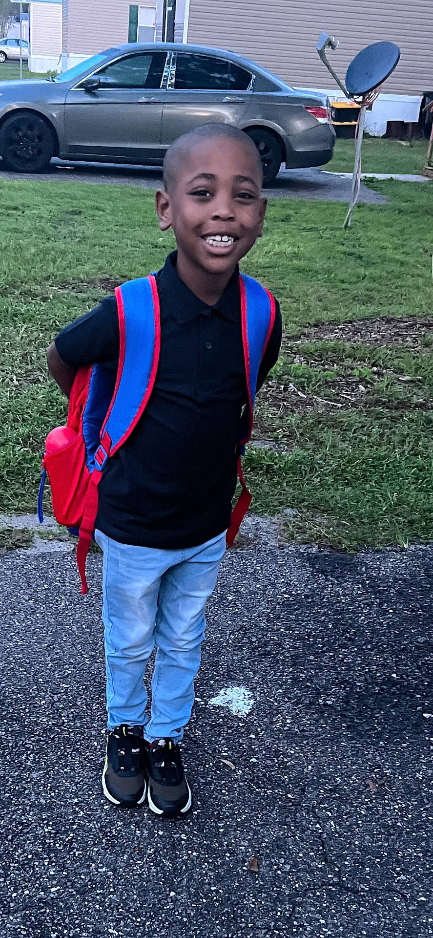 Joziah joined the competition — help win amazing prizes! alloywheel, boy, car, carwheel, child, clothing, face, footwear, gravel, head, machine, male, pants, person, shoe, spoke, tire, transportation, vehicle, wheel