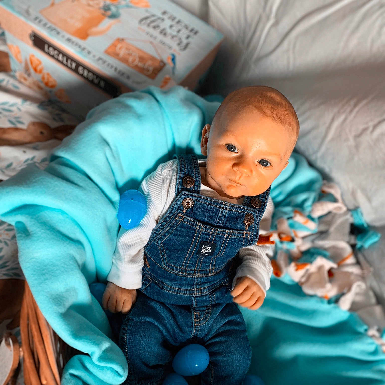 Ryker joined the competition — help win amazing prizes! abdomen, art, azure, baby, baby_toddler_clothing, bedding, child, comfort, doll, electric_blue, fictional_character, human_body, linens, pattern, plastic, room, sitting, sleeve, toddler, toy