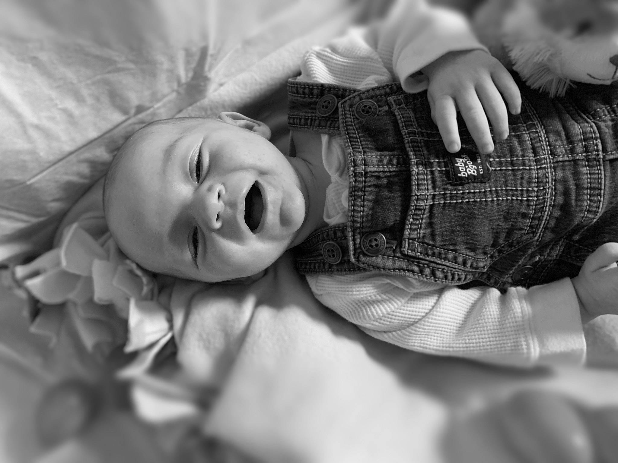 Ryker is registered to the contest to win money with this photo: baby, black, black_and_white, comfort, elbow, flash_photography, fun, gesture, grass, happy, human_body, iris, mammal, mouth, person, skin, smile, style, tartan, toddler