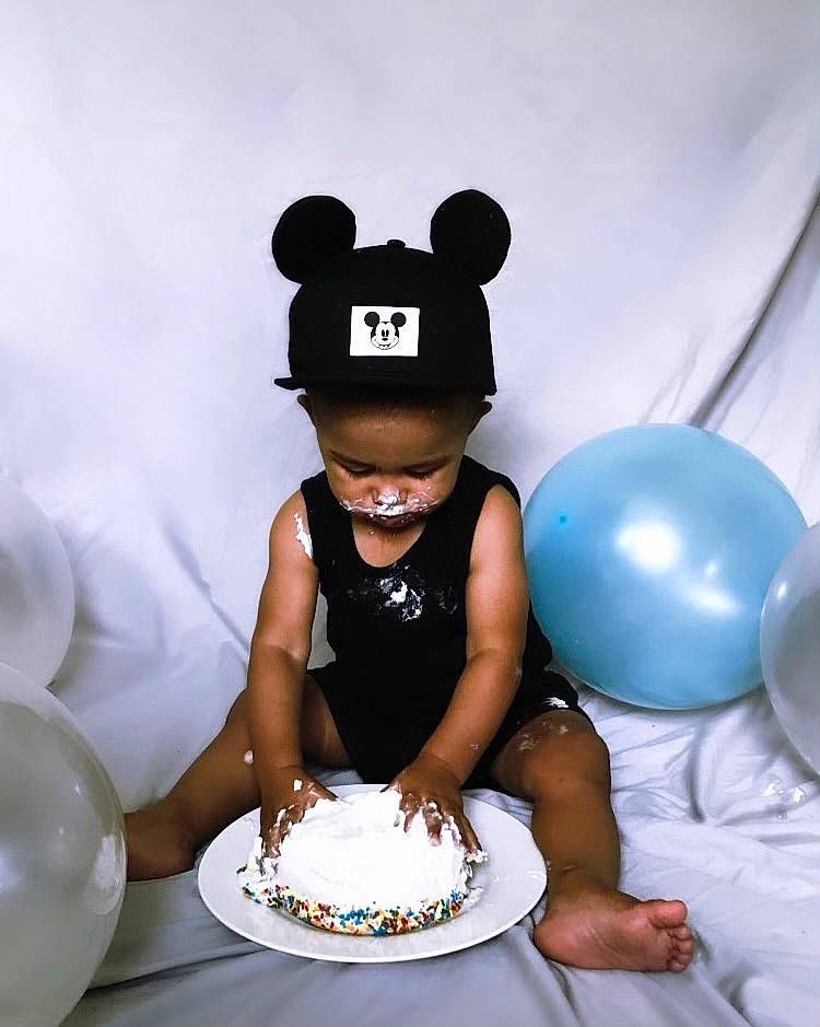 Dontae is registered to the contest to win money with this photo: baked_goods, baking, balloon, birthday_cake, cake, cake_decorating, cake_decorating_supply, dessert, event, food, happy, hat, icing, person, plate, shorts, sugar_cake, sugar_paste, sweetness, tableware