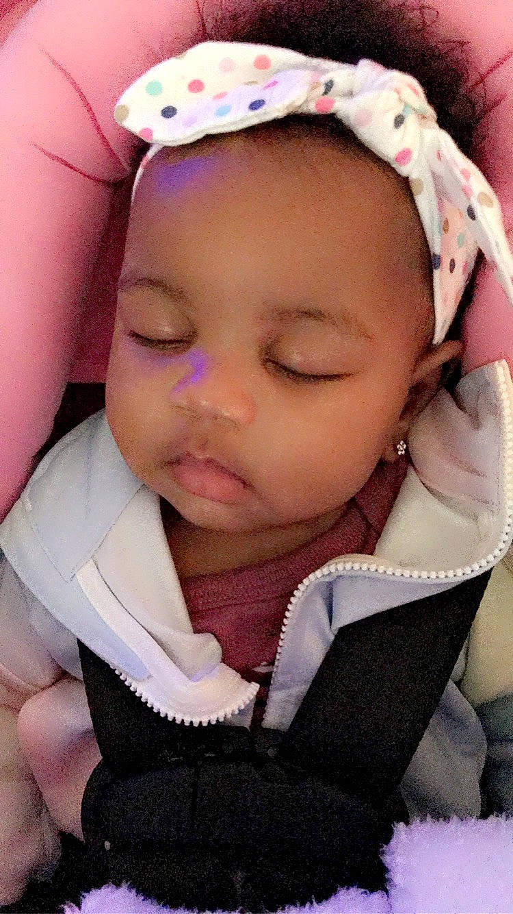 Bianca is registered to the contest to win money with this photo: baby, baby_products, baby_sleeping, baby_toddler_clothing, bedtime, cheek, child, comfort, eyebrow, hair_accessory, headband, headgear, lip, nail, nap, pattern, person, pink, skin, sleep