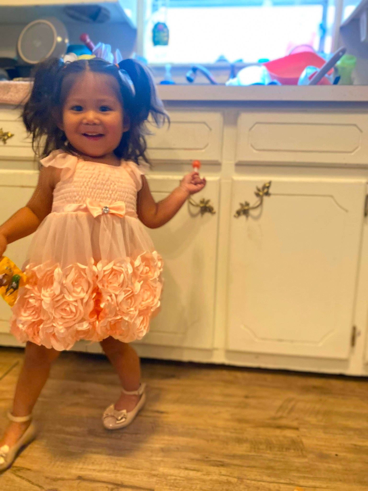Kinslie joined the competition — help win amazing prizes! cabinetry, chest_of_drawers, child, drawer, entertainment, event, floor, flooring, fun, happy, hardwood, hat, home_appliance, human_leg, joy, kitchen, kitchen_appliance, person, shoe, smile