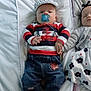 Franky a rejoint le concours — aidez-le/la à gagner de superbes lots ! baby, infant, child, pacifier, cap, striped_shirt, denim_pants, floral_dress, cardigan, headband, holding_hands, sleeping, lying_down, white_bedding, couch, soft_lighting, indoor, cute, toddler, two_children