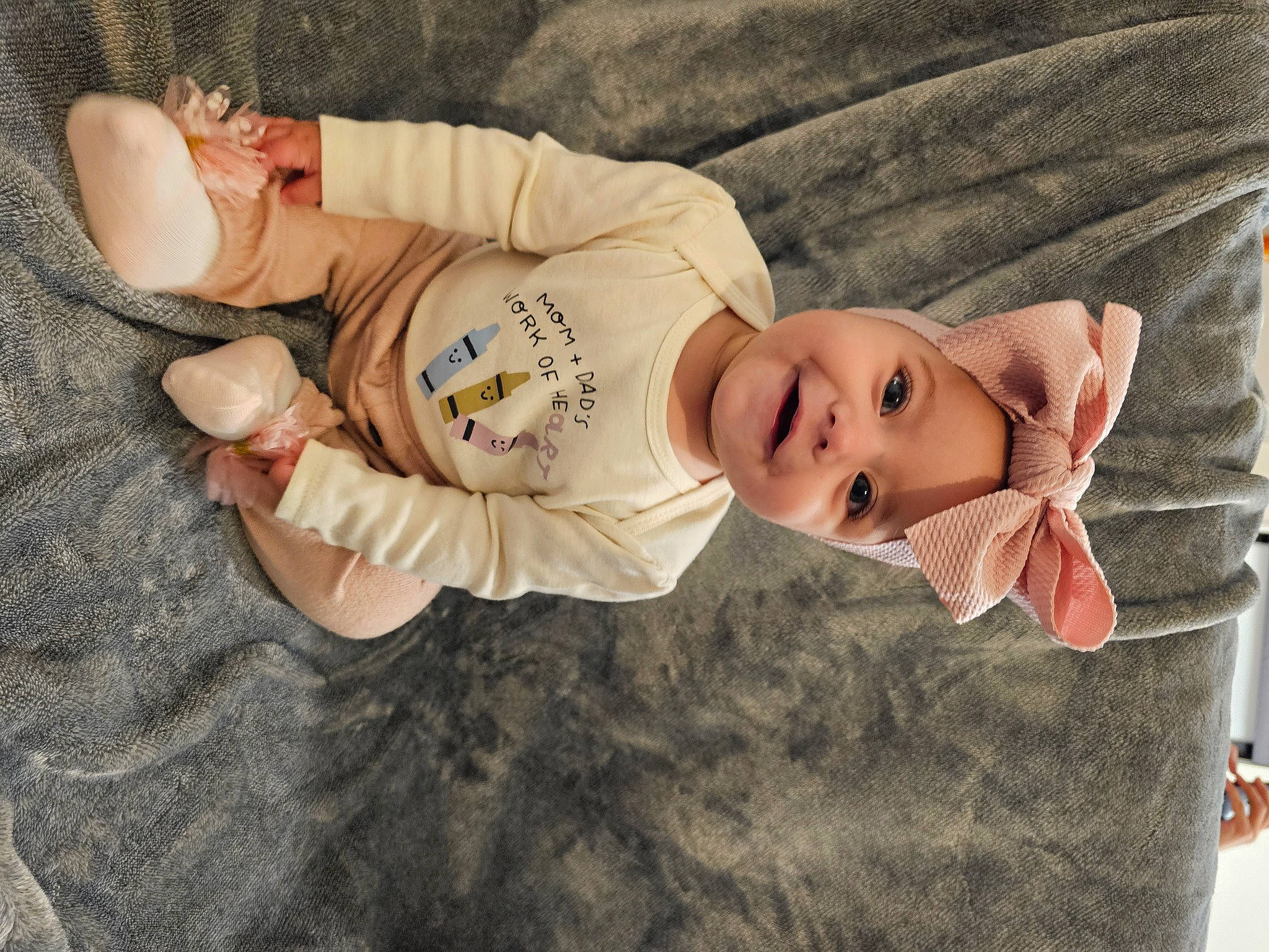 Sofia is registered to the contest to win money with this photo: baby, baby_toddler_clothing, cheek, child, comfort, eye, fur, grass, hat, headwear, human_body, joy, lip, mammal, outerwear, pattern, person, sitting, skin, sleeve