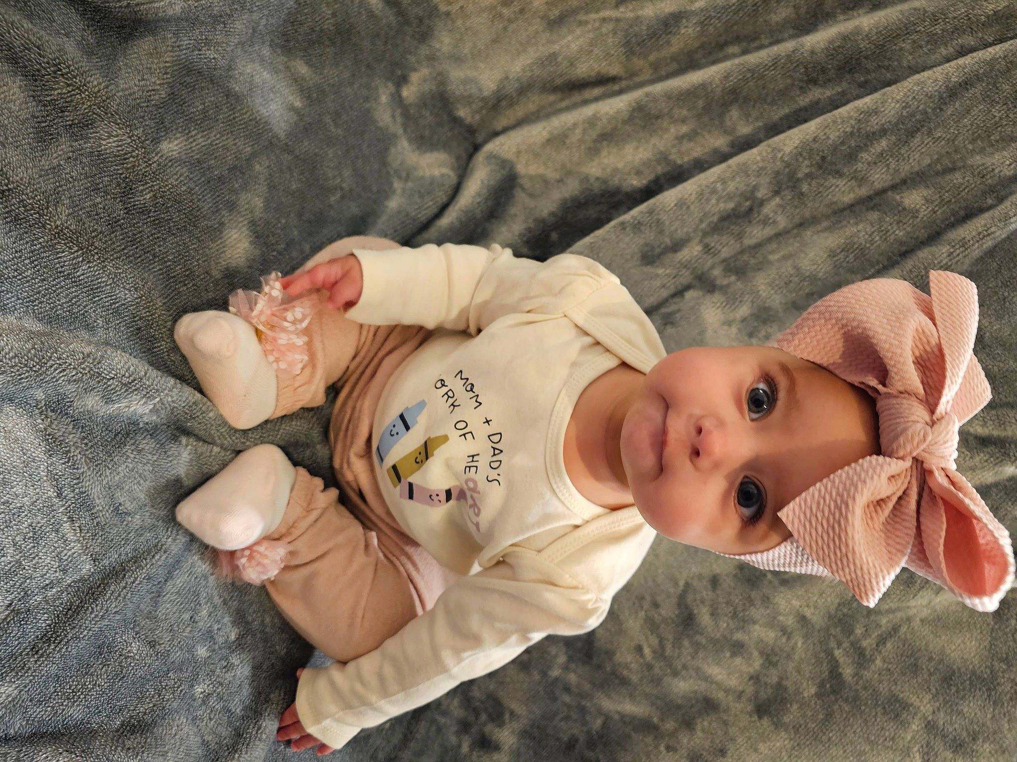 Sofia joined the competition — help win amazing prizes! baby, baby_toddler_clothing, cheek, child, comfort, eye, finger, grass, hand, happy, headwear, human_body, nose, person, plant, sitting, skin, sleeve, textile, toddler