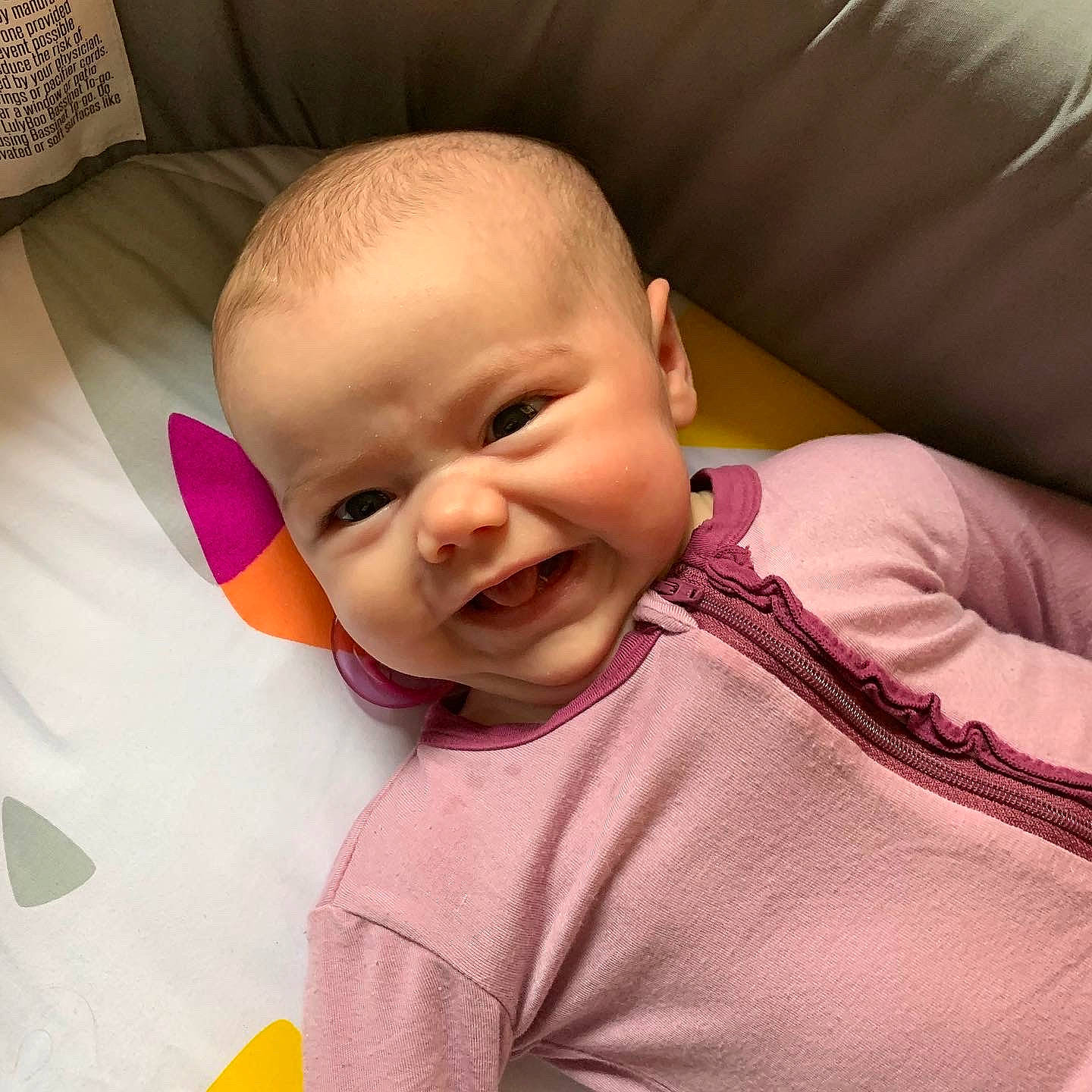 Gemma is registered to the contest to win money with this photo: baby, baby_making_funny_faces, cheek, child, chin, ear, eye, face, facial_expression, happy, head, lip, mouth, nose, person, pink, product, skin, smile, toddler