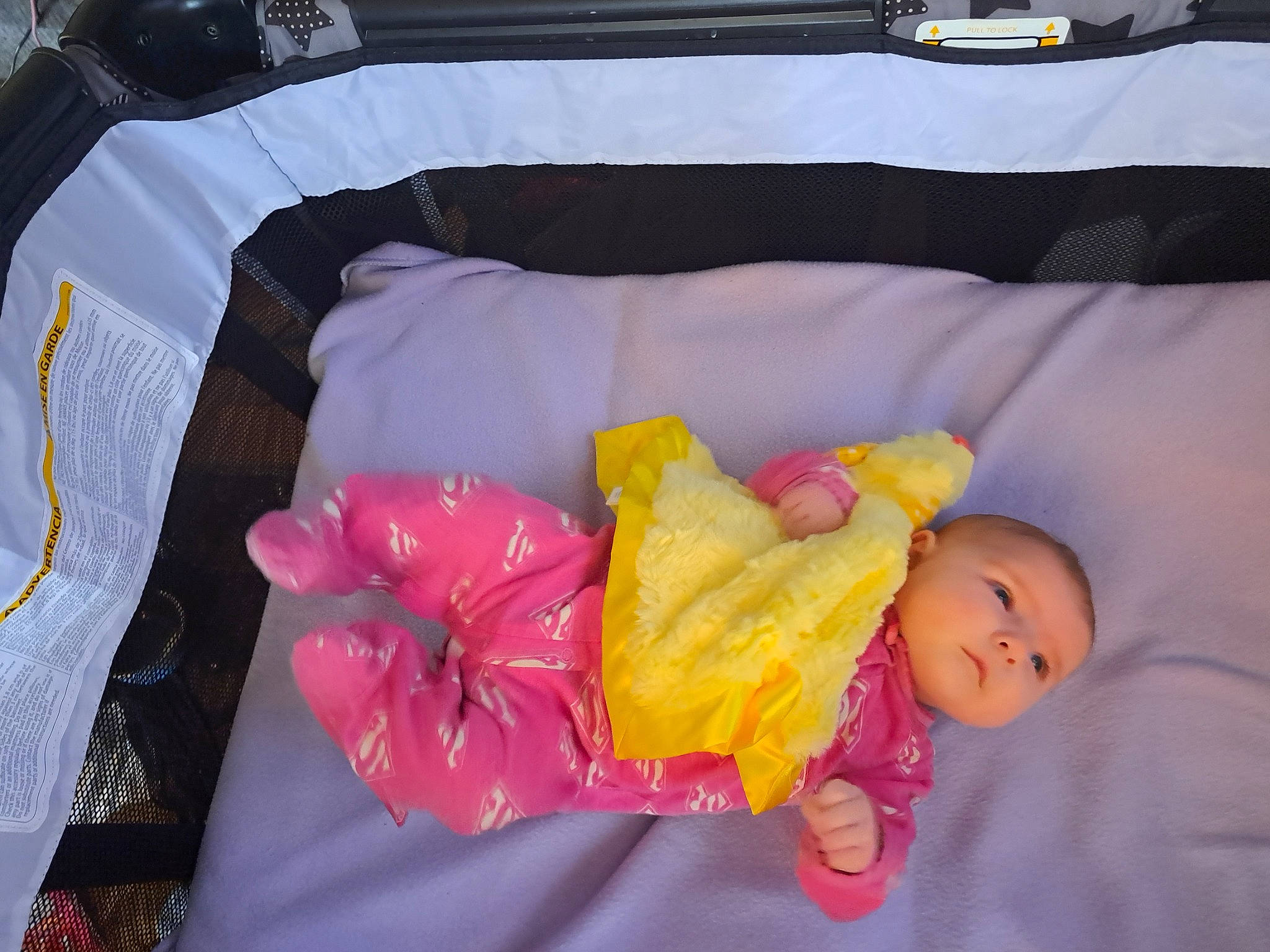 Lilian is registered to the contest to win money with this photo: baby, baby_products, bed, child, coffin, comfort, couch, dress, fun, hand, infant_bed, linens, magenta, nap, orange, person, pink, room, textile, toddler