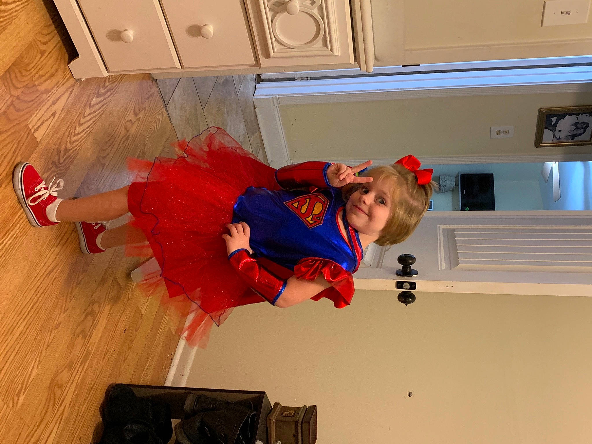 Esmae is registered to the contest to win money with this photo: arm, floor, flooring, fun, joy, person, red