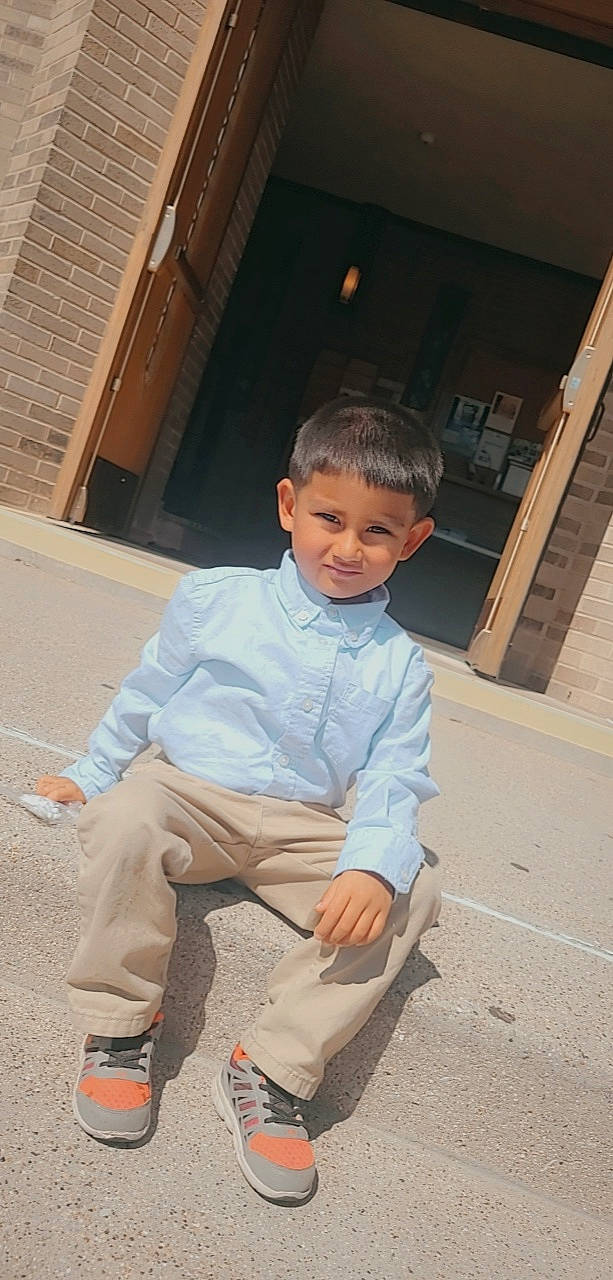 Sotero is registered to the contest to win money with this photo: child, concrete, door, dress_shirt, eye, flooring, fun, happy, leisure, people, person, rolling, sandal, sitting, skateboarder, sleeve, smile, standing, toddler, vacation