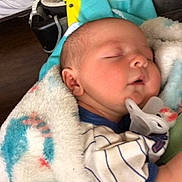 Kayson is registered to the contest to win money with this photo: architecture, baby, bed, bedroom, blanket, building, clothing, cushion, face, furniture, glove, head, homedecor, hospital, newborn, person, photography, portrait, quilt, sleeping