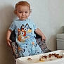 baby, chair, clothing, cream, dessert, dress, eating, face, food, furniture, happy, head, icecream, person, photography, portrait, sitting, sleeve, sweets, t_shirt