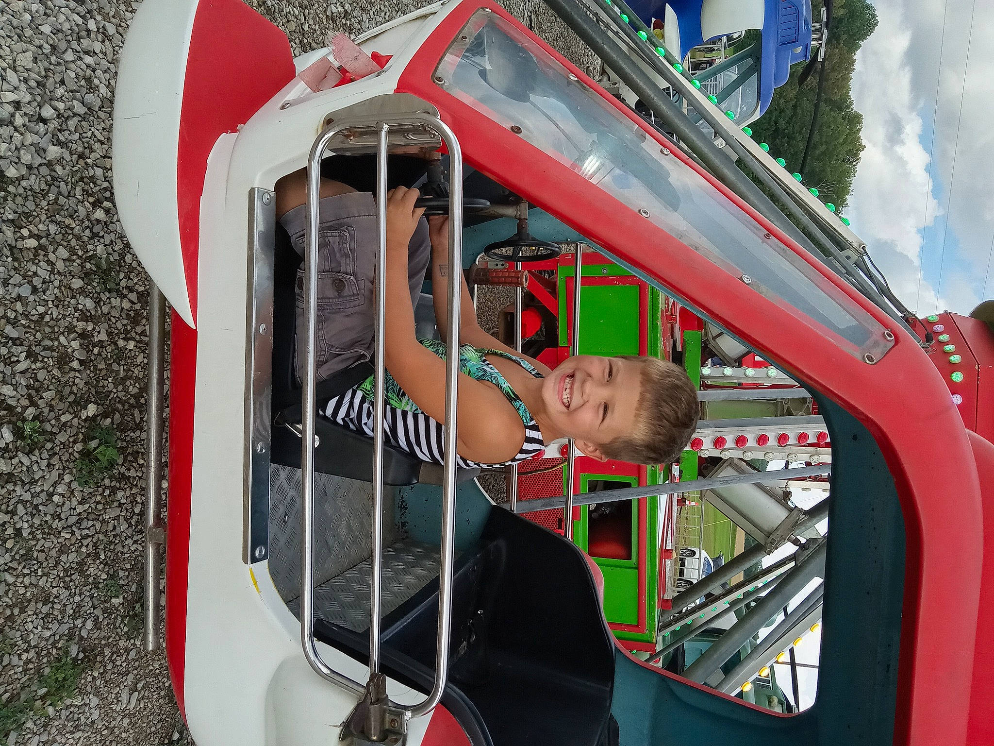 Logan Keith joined the competition — help win amazing prizes! auto_part, automotive_design, automotive_exterior, automotive_lighting, automotive_tire, automotive_wheel_system, bumper, cloud, emergency_service, hood, joy, motor_vehicle, person, personal_protective_equipment, recreation, shorts, sky, sunglasses, t_shirt, vehicle