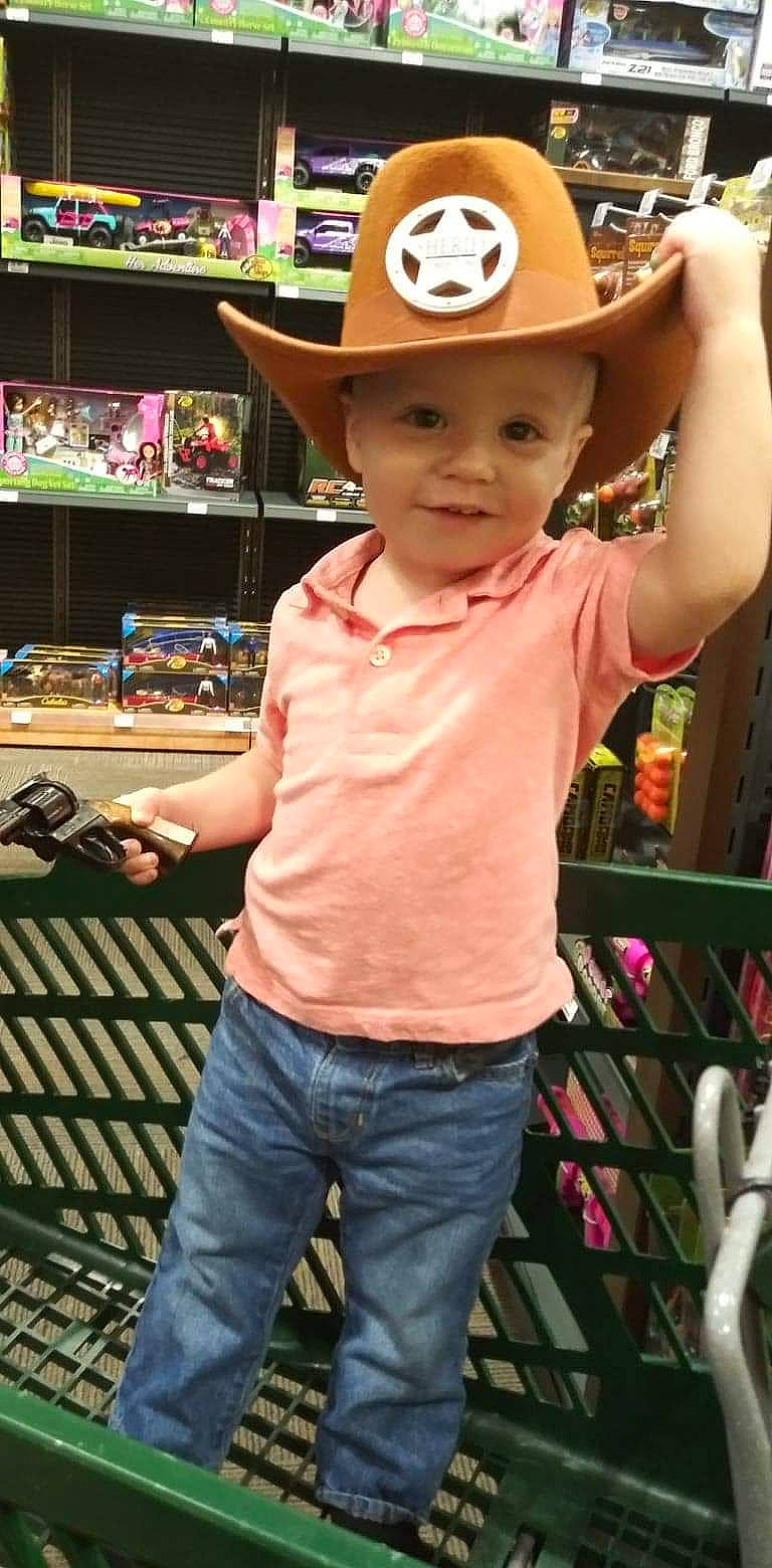 Logan is registered to the contest to win money with this photo: cap, child, child_model, clothing, cool, cowboy_hat, fashion_accessory, hat, headgear, headwear, joy, person, sleeve, sun_hat, toddler
