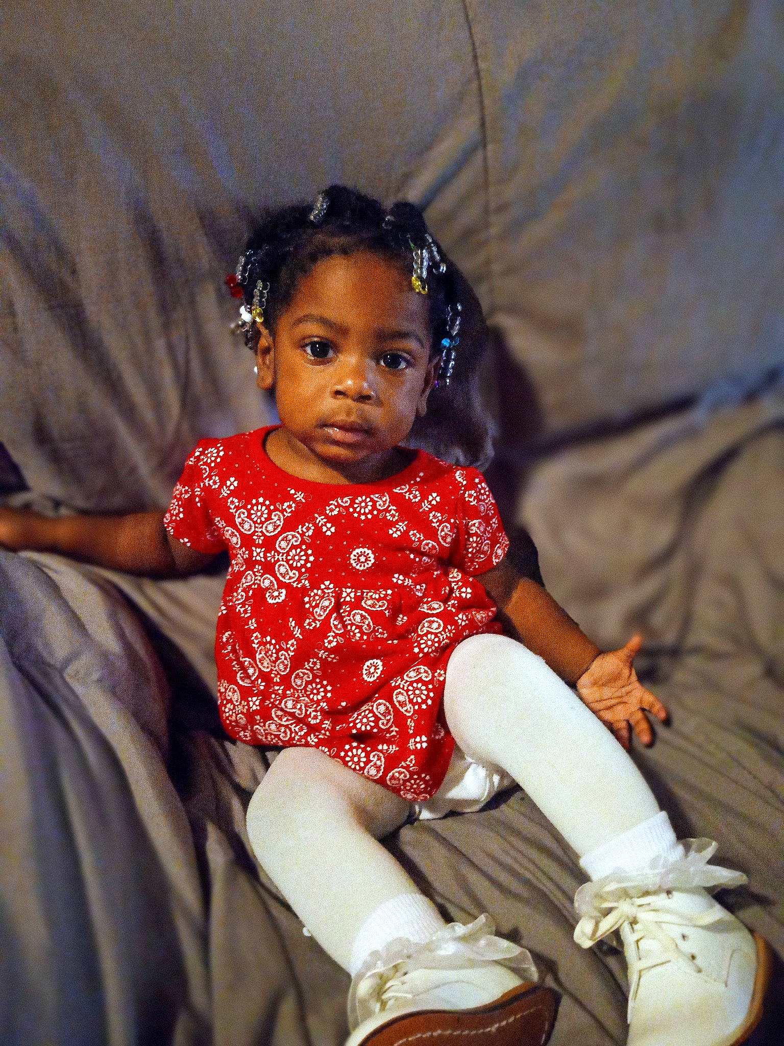 Faith is registered to the contest to win money with this photo: baby, baby_toddler_clothing, child, child_model, dress, event, fashion_accessory, fashion_design, flash_photography, fun, happy, human_leg, jewellery, magenta, pattern, person, portrait_photography, sitting, sock, toddler