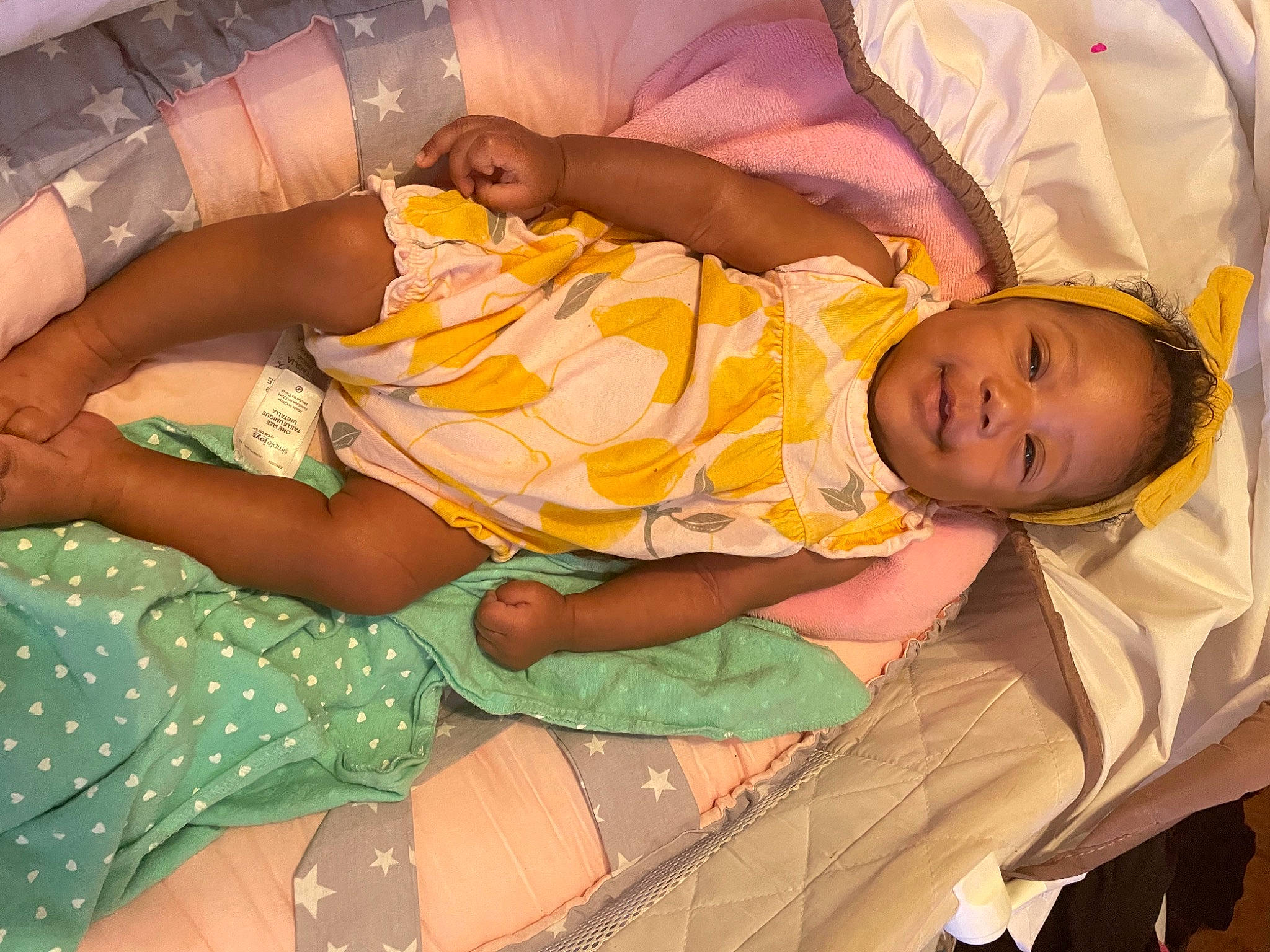 Kenzie is registered to the contest to win money with this photo: abdomen, arm, baby, baby_toddler_clothing, child, comfort, elbow, event, fun, hand, happy, human_body, human_leg, lap, leg, pattern, person, room, thigh, toddler