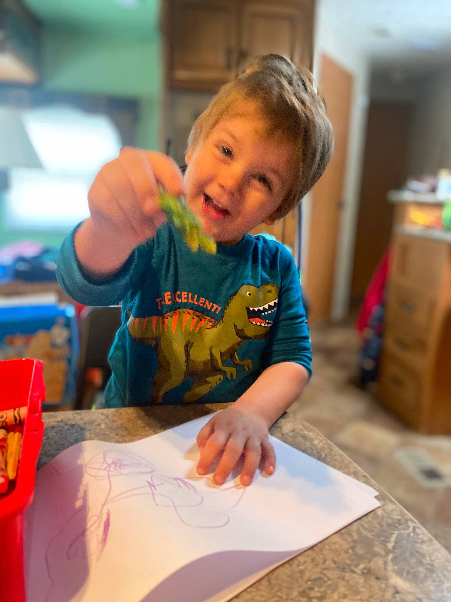 Aaron is registered to the contest to win money with this photo: chair, child, education, event, fun, happy, homework, leisure, pen, person, play, room, sitting, t_shirt, table, toddler, vacation, visual_arts, wood, writing