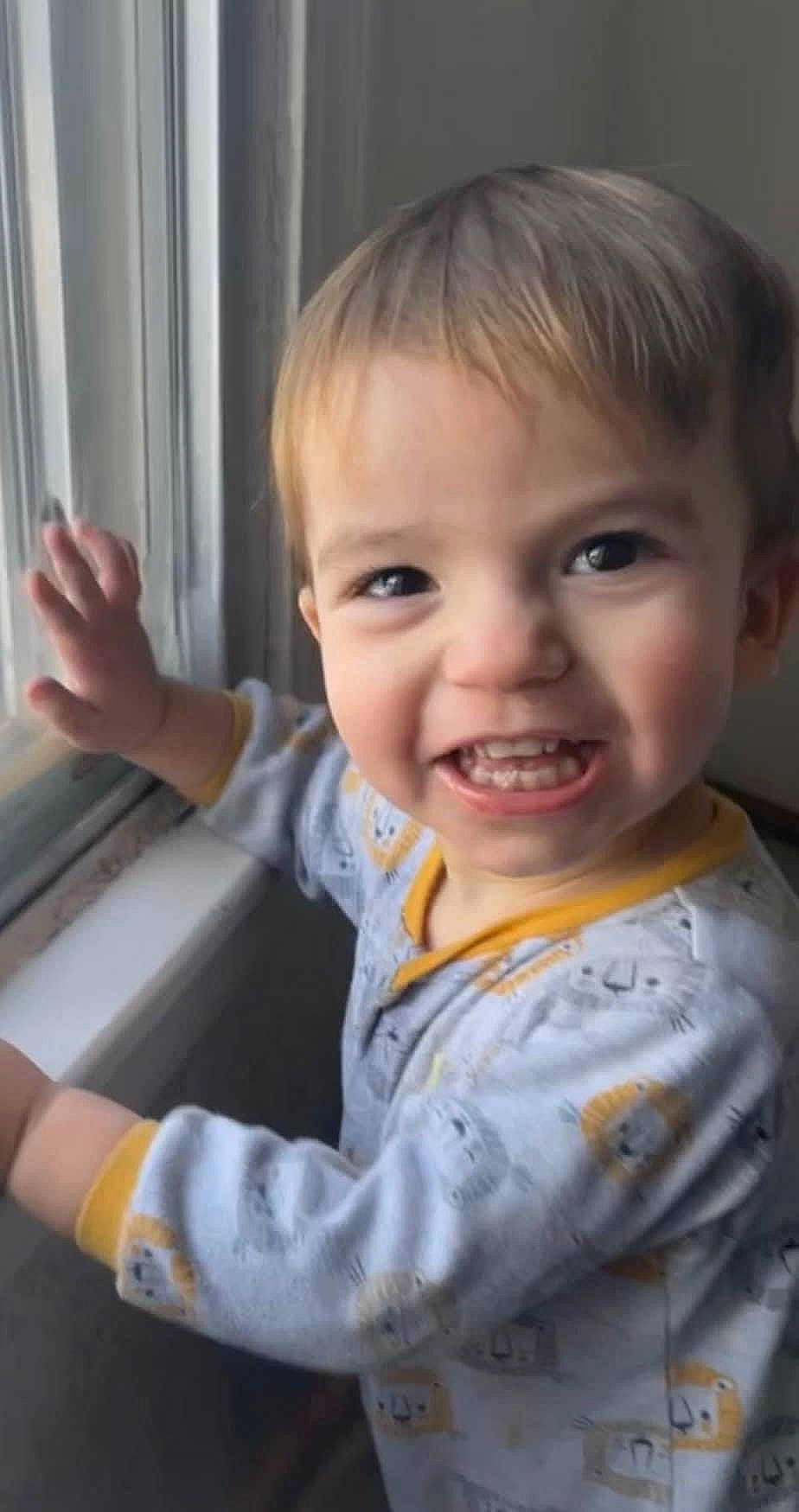 Kylan is registered to the contest to win money with this photo: baby, baby_toddler_clothing, cheek, chin, eye, eyebrow, facial_expression, fun, gesture, happy, iris, joy, lip, mouth, nose, person, skin, sleeve, smile, standing