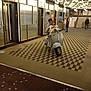 Amayas a rejoint le concours — aidez-le/la à gagner de superbes lots ! child, children, scooter, vespa, indoor, elevator, floor_pattern, lighting, hugging, smiling, person, stairs, adult, carpet, metal, architecture, transport, playful, modern, public_space