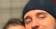 Valentina joined the competition — help win amazing prizes! baby, background, beanie, beard, casual, child, clothing, cute, face, family, headwear, holding, indoor, infant, man, parent, person, portrait, selfie, smile